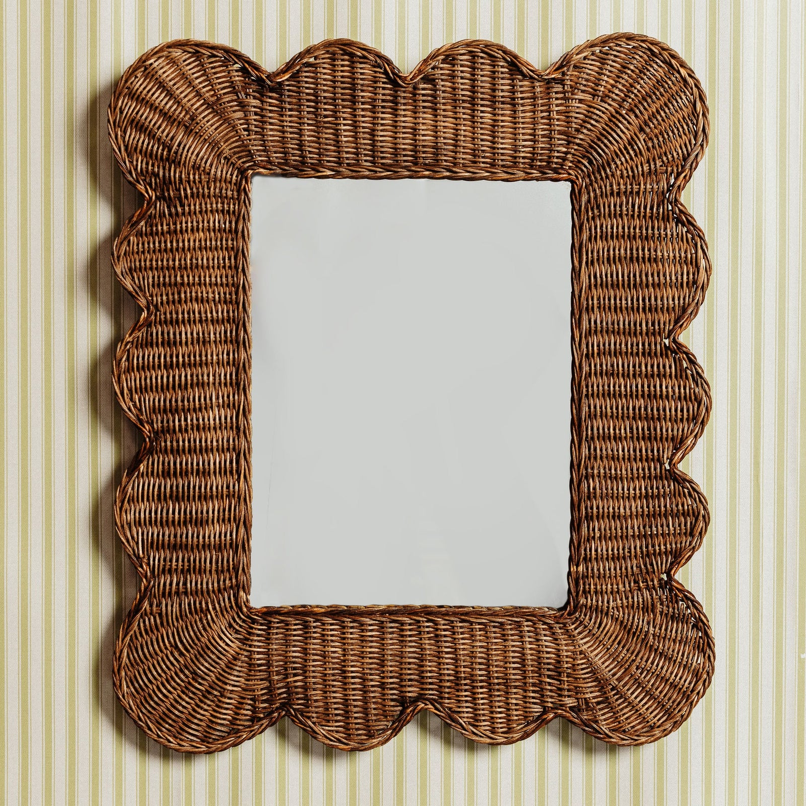 Mimi-scalloped-mirror-medium-teak-on-a-wall
