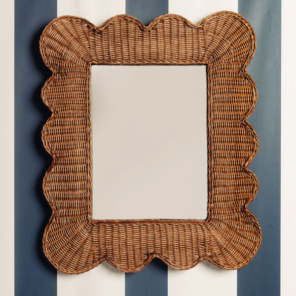 Mimi-scalloped-mirror-medium-teak-on-a-wall