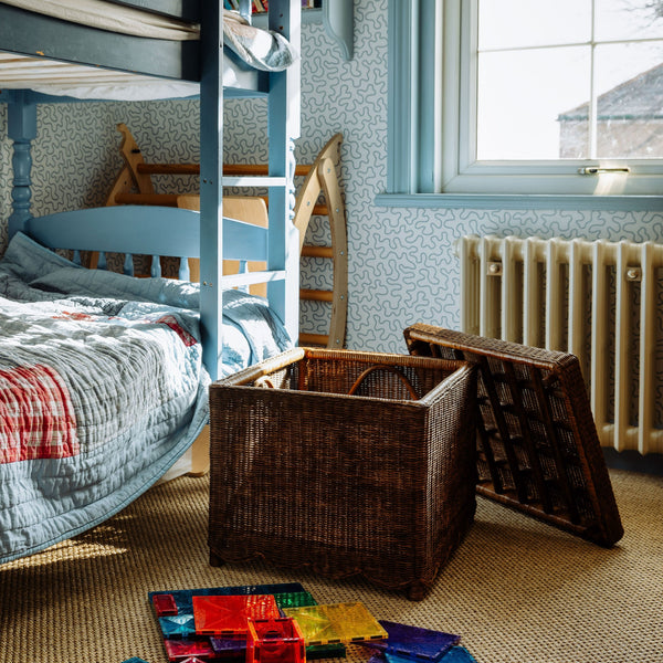 NINA-SCALLOPED-OTTOMAN-TEAK-IN-PLAYROOM