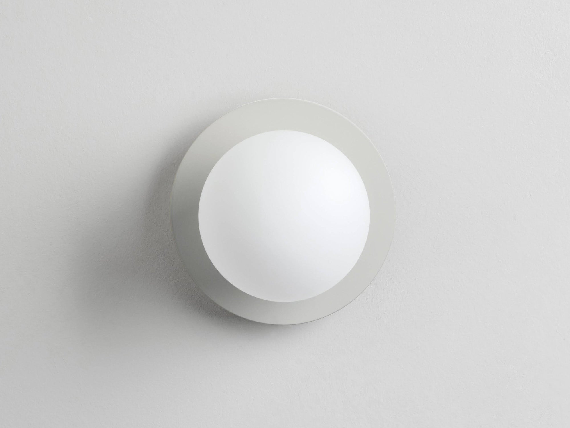 Sand opal disc wall light