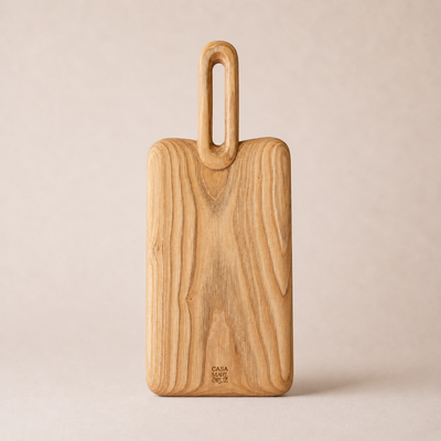 Wooden cutting board with handle on a beige background