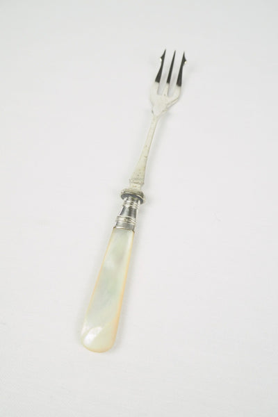 This Antique Pickle Fork is the perfect piece for your kitchen. With a beautiful Mother of Pearl handle and a Silver Plated neck and barbed prongs. Wildmore