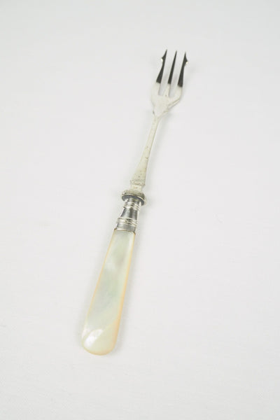 This Antique Pickle Fork is the perfect piece for your kitchen. With a beautiful Mother of Pearl handle and a Silver Plated neck and barbed prongs. Wildmore