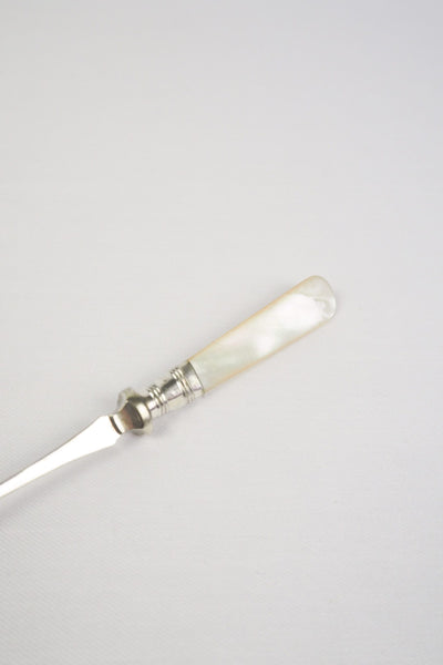 This Antique Pickle Fork is the perfect piece for your kitchen. With a beautiful Mother of Pearl handle and a Silver Plated neck and barbed prongs. Wildmore