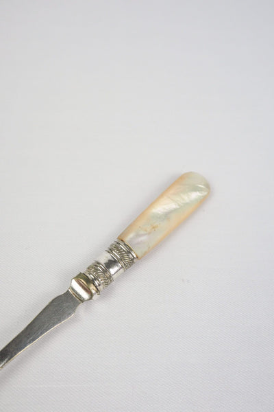 This Antique Pickle Fork is the perfect piece for your kitchen. With a beautiful Mother of Pearl handle and a Silver Plated neck and barbed prongs. Wildmore