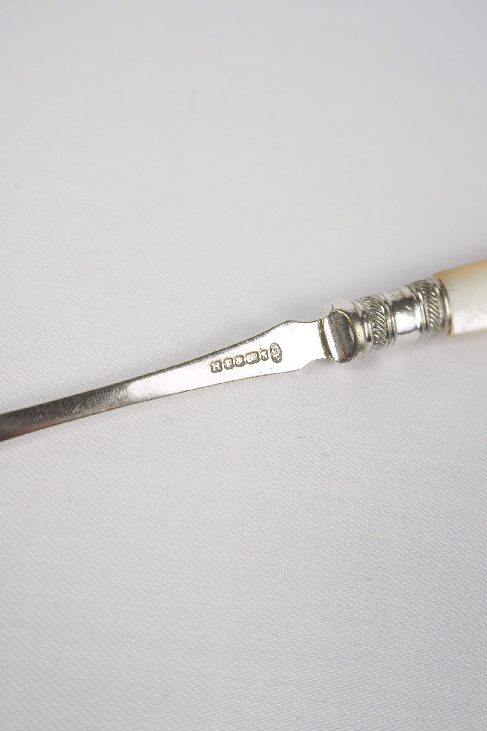 This Antique Pickle Fork is the perfect piece for your kitchen. With a beautiful Mother of Pearl handle and a Silver Plated neck and barbed prongs. Wildmore