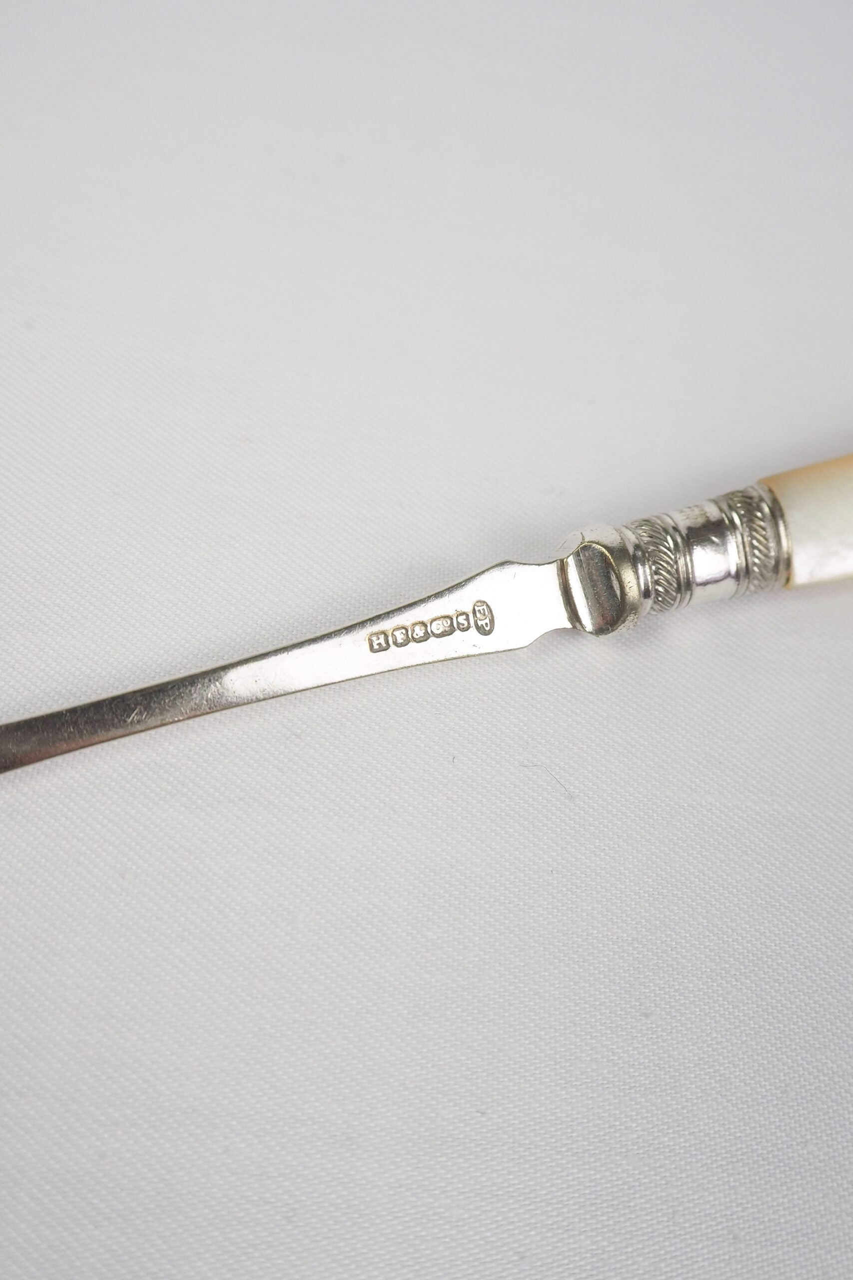 This Antique Pickle Fork is the perfect piece for your kitchen. With a beautiful Mother of Pearl handle and a Silver Plated neck and barbed prongs. Wildmore
