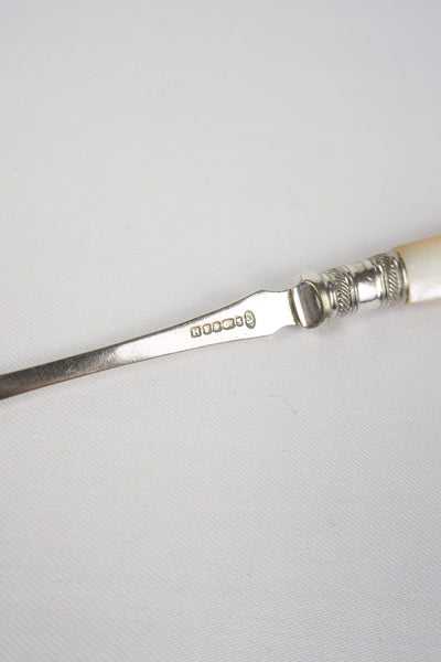 This Antique Pickle Fork is the perfect piece for your kitchen. With a beautiful Mother of Pearl handle and a Silver Plated neck and barbed prongs. Wildmore