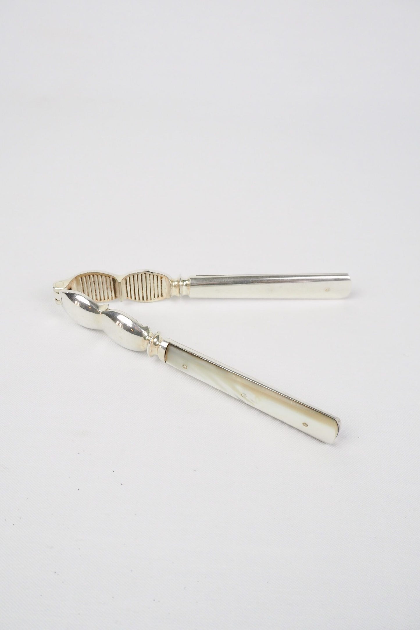 Vintage Silver Plate Nutcrackers with mother of pearl inlaid handles. Wildmore