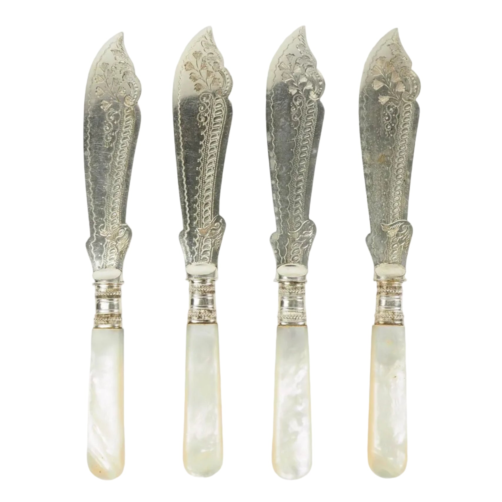 A Set of 4 Antique Silver Plate Fish Knives with mother of pearl handles. The blade of each Victorian Fish Knife has a beautifully etched floral pattern. Wildmore