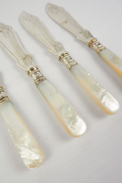 A Set of 4 Antique Silver Plate Fish Knives with mother of pearl handles. The blade of each Victorian Fish Knife has a beautifully etched floral pattern. Wildmore