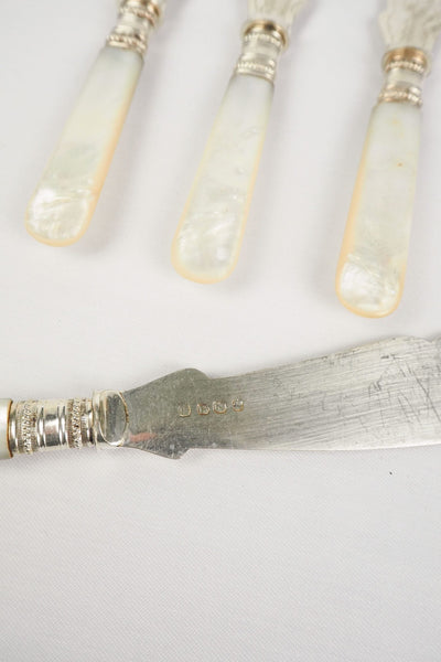 A Set of 4 Antique Silver Plate Fish Knives with mother of pearl handles. The blade of each Victorian Fish Knife has a beautifully etched floral pattern. Wildmore