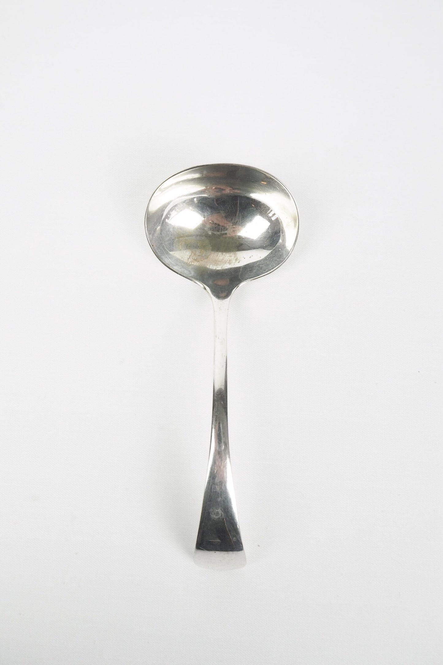 This Vintage Silver Plate Ladle is a stunning piece of service ware. It's characterful patina is perfect for an elegant tablescape and for dishing up your favourite soups. Wildmore