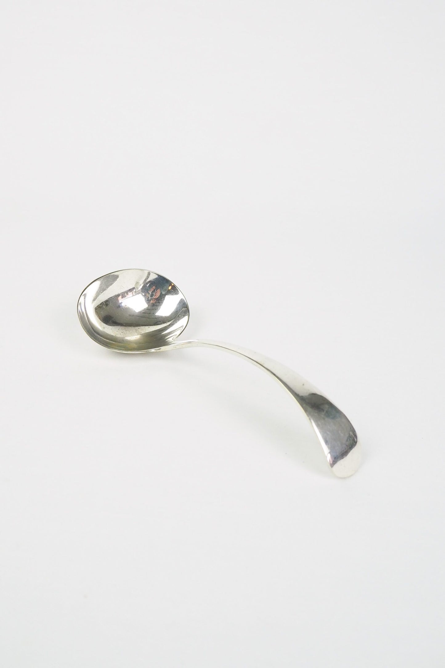 This Vintage Silver Plate Ladle is a stunning piece of service ware. It's characterful patina is perfect for an elegant tablescape and for dishing up your favourite soups. Wildmore