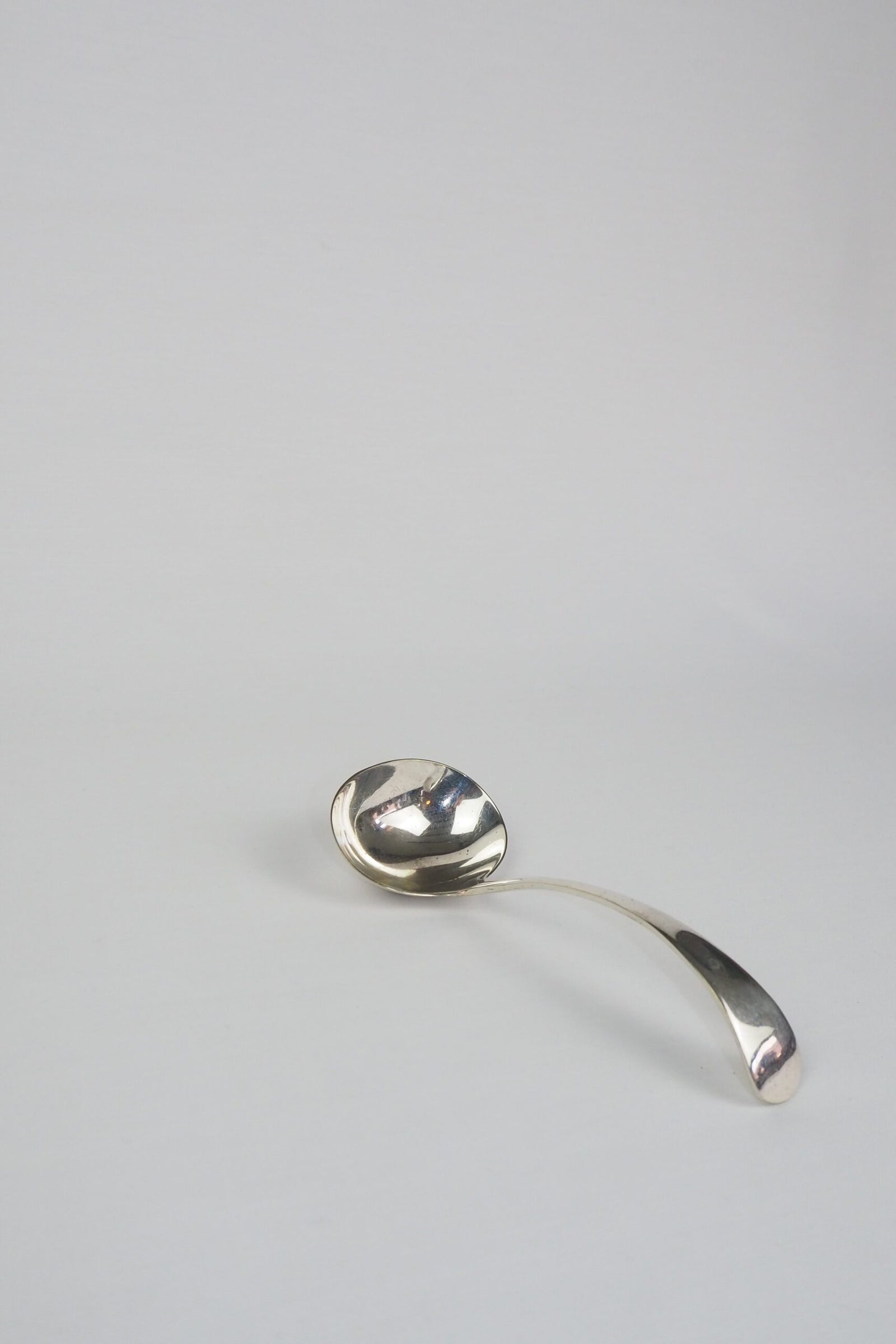 This Vintage Silver Plate Ladle is a stunning piece of service ware. It's characterful patina is perfect for an elegant tablescape and for dishing up your favourite soups. Wildmore