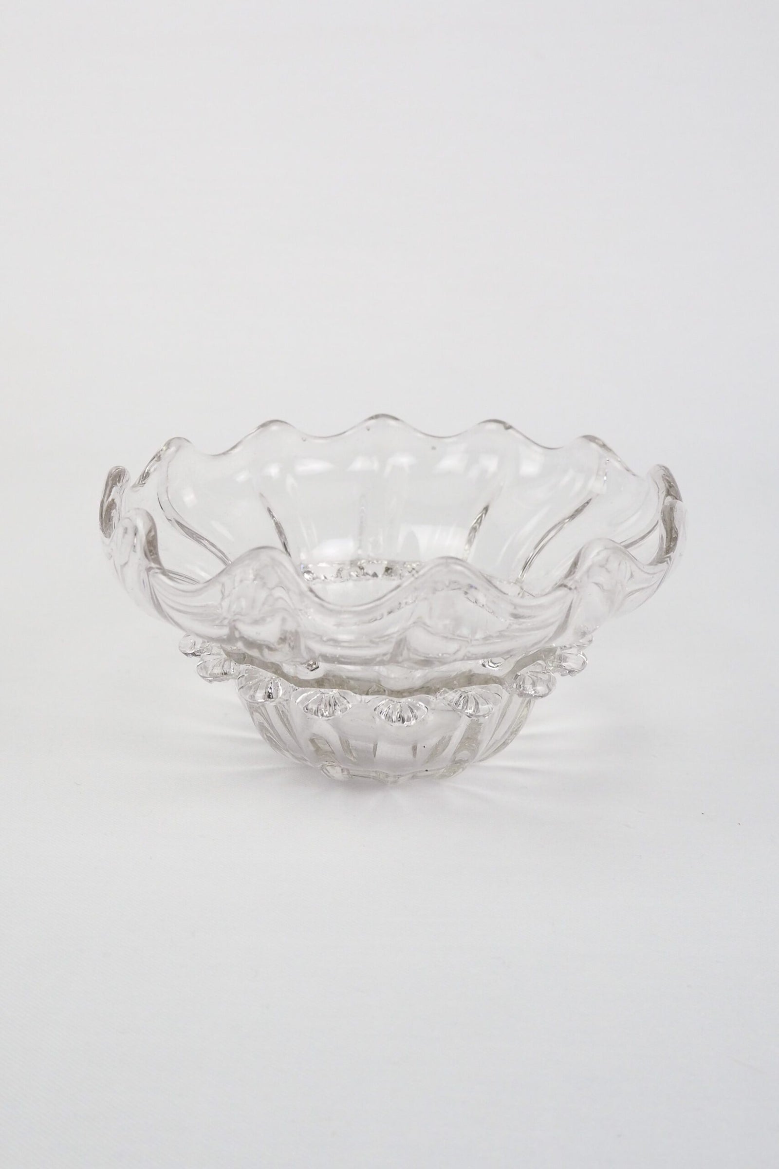 A stunning Vintage Hand Blown Glass Dish with delicate bubbles running through the glass giving it a gorgeous viscous look. Hand blown Mid-Century glass dish with a petal pattern around the centre. Wildmore