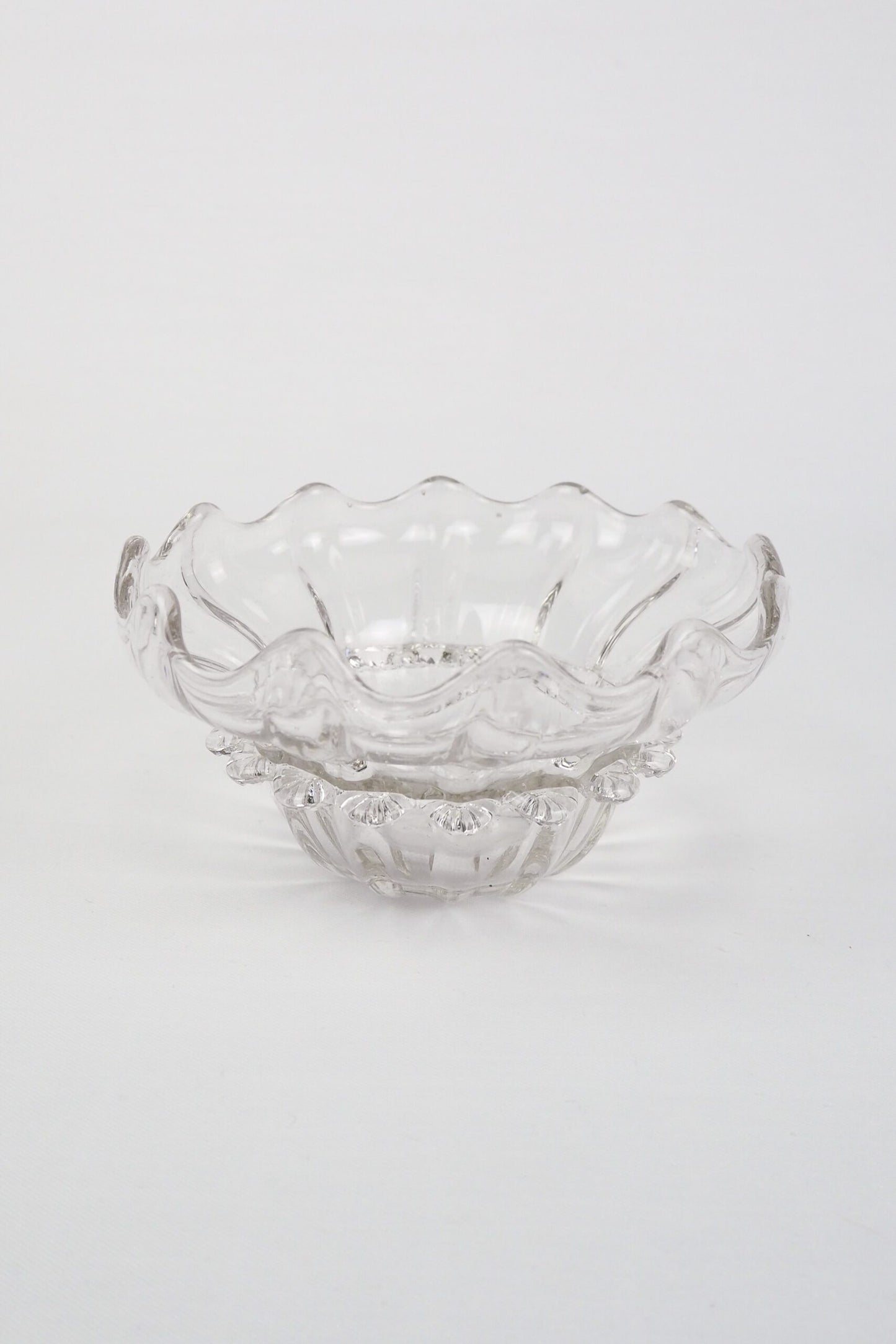 A stunning Vintage Hand Blown Glass Dish with delicate bubbles running through the glass giving it a gorgeous viscous look. Hand blown Mid-Century glass dish with a petal pattern around the centre. Wildmore
