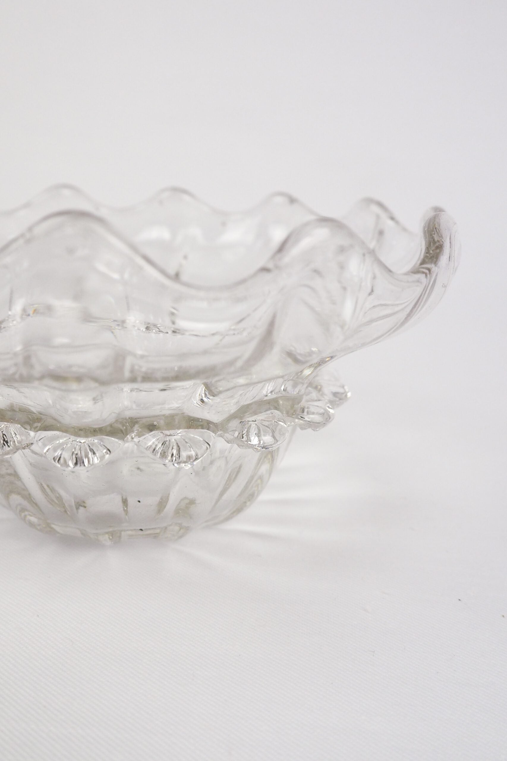 A stunning Vintage Hand Blown Glass Dish with delicate bubbles running through the glass giving it a gorgeous viscous look. Hand blown Mid-Century glass dish with a petal pattern around the centre. Wildmore