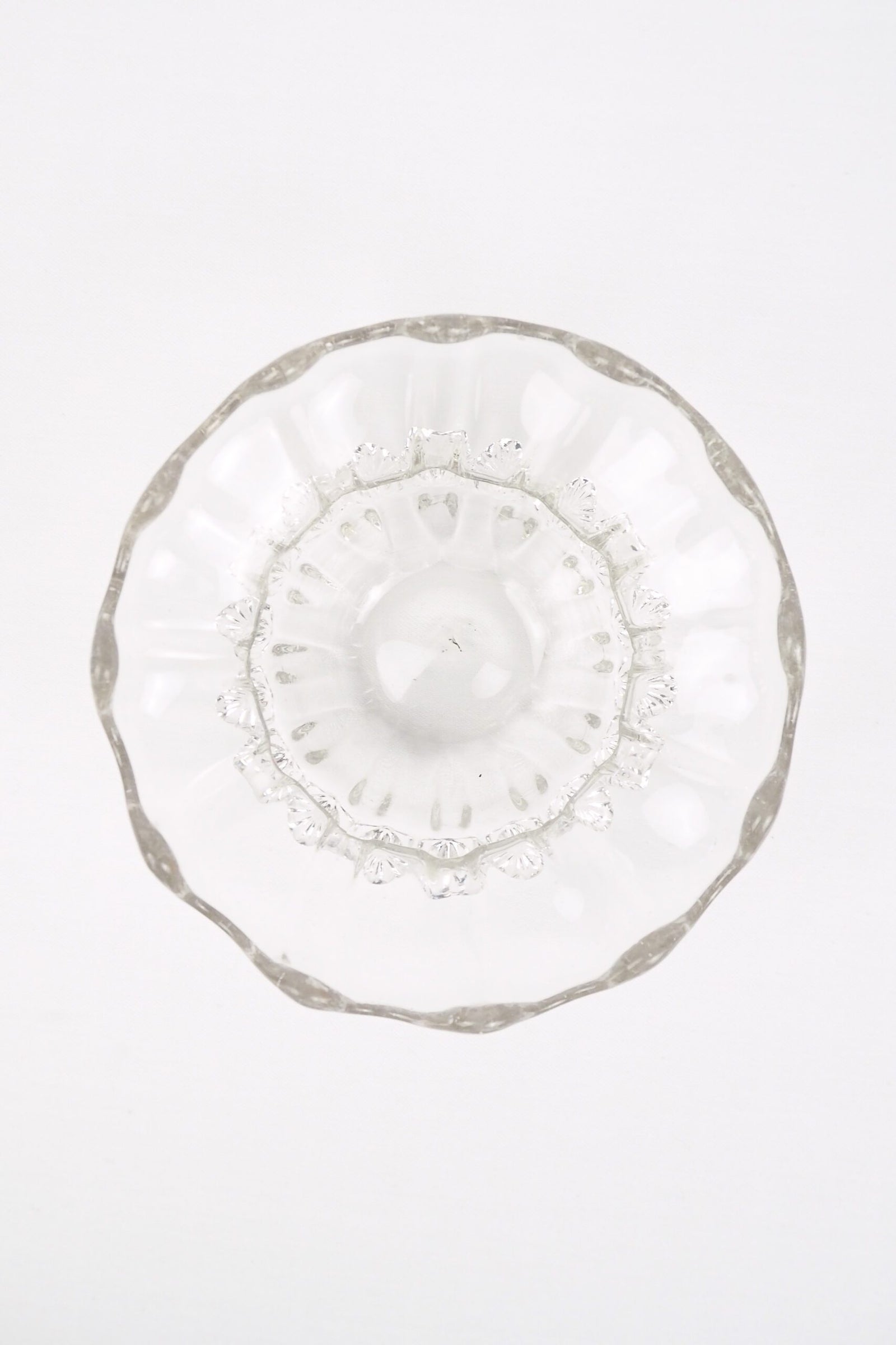 A stunning Vintage Hand Blown Glass Dish with delicate bubbles running through the glass giving it a gorgeous viscous look. Hand blown Mid-Century glass dish with a petal pattern around the centre. Wildmore