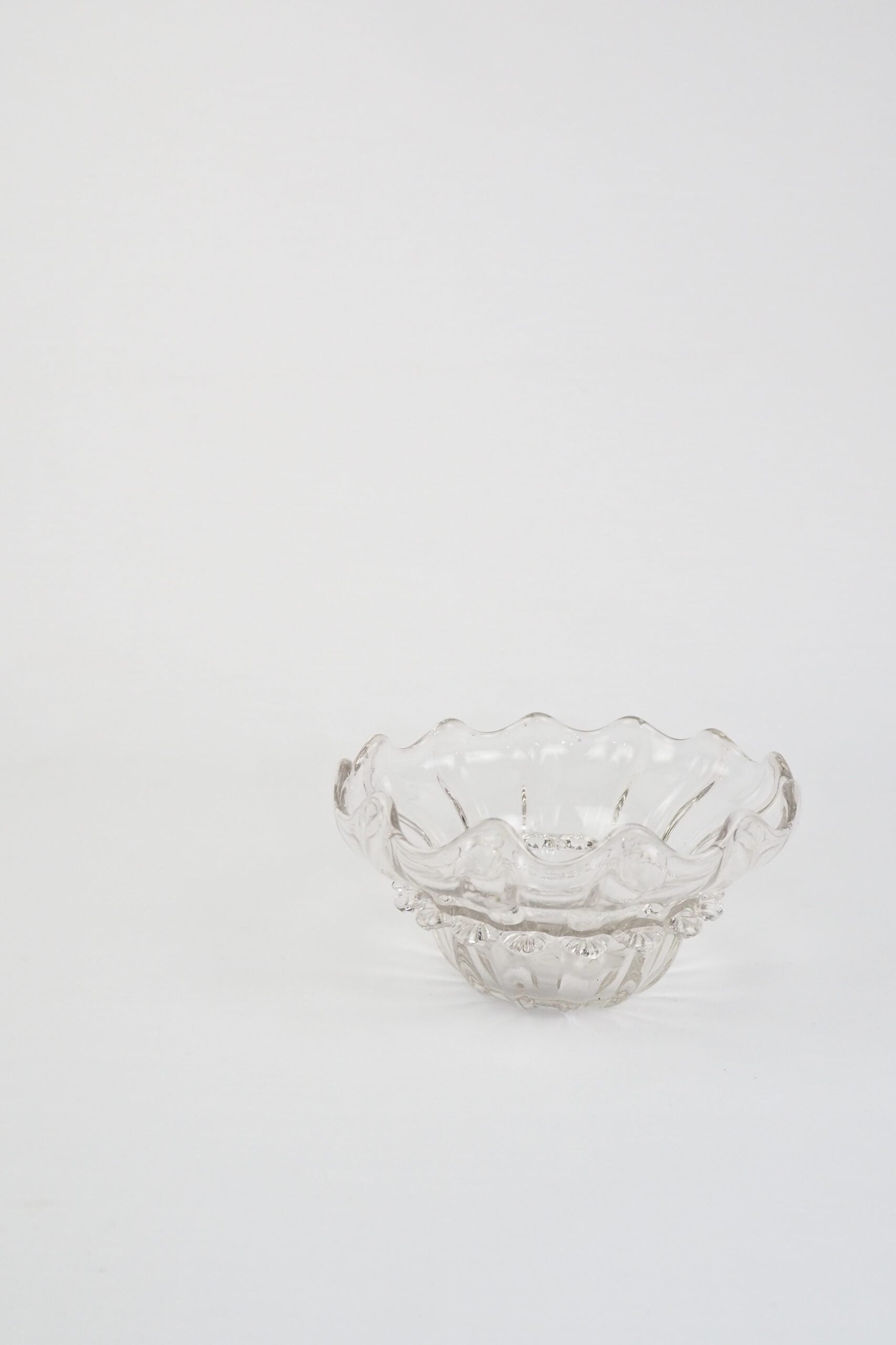 A stunning Vintage Hand Blown Glass Dish with delicate bubbles running through the glass giving it a gorgeous viscous look. Hand blown Mid-Century glass dish with a petal pattern around the centre. Wildmore