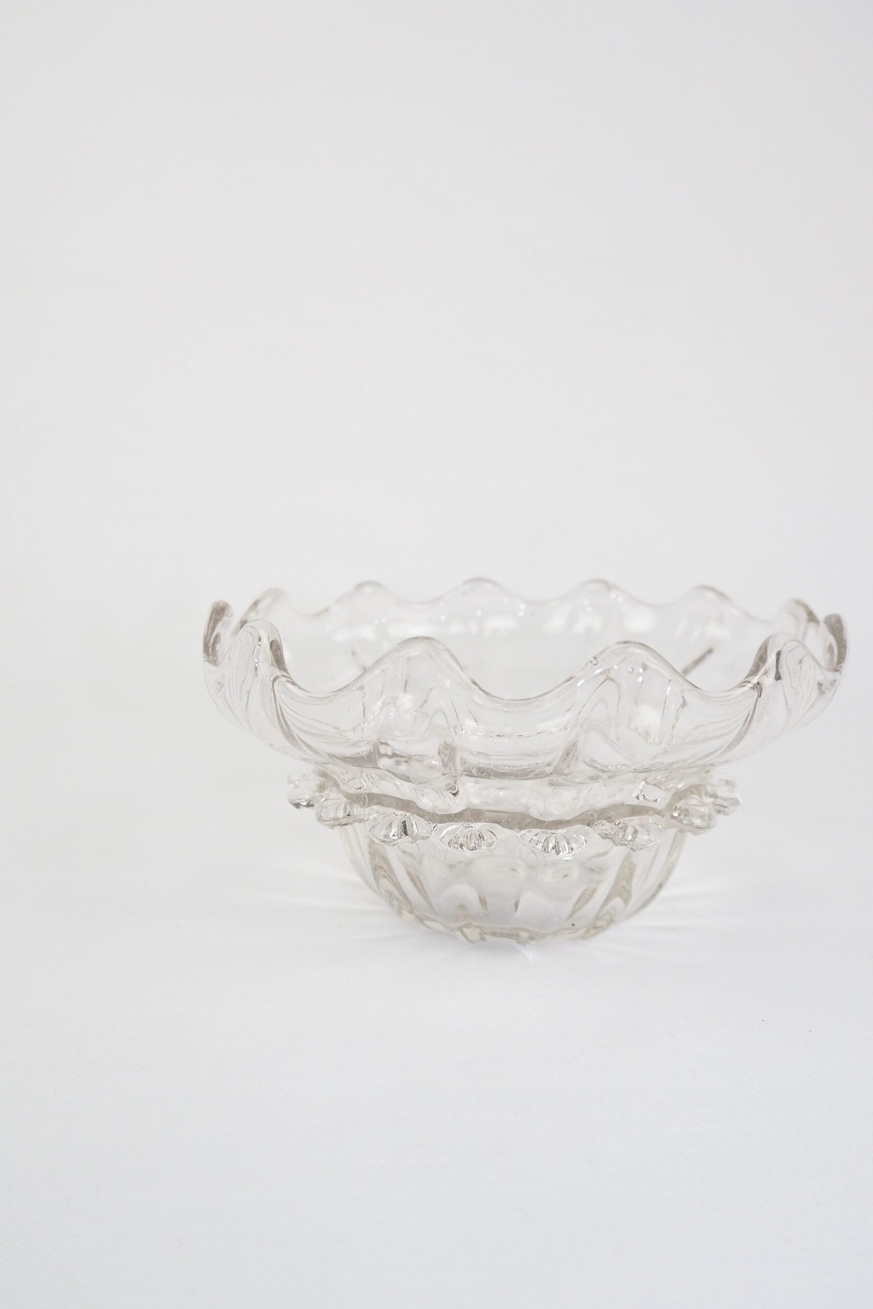 A stunning Vintage Hand Blown Glass Dish with delicate bubbles running through the glass giving it a gorgeous viscous look. Hand blown Mid-Century glass dish with a petal pattern around the centre. Wildmore