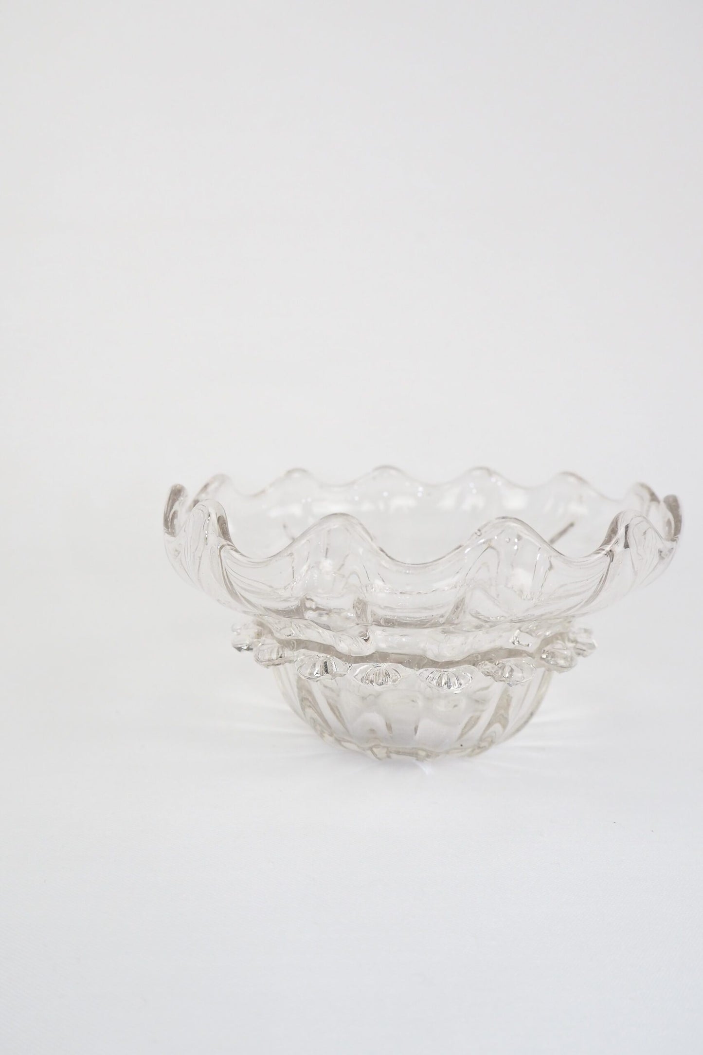 A stunning Vintage Hand Blown Glass Dish with delicate bubbles running through the glass giving it a gorgeous viscous look. Hand blown Mid-Century glass dish with a petal pattern around the centre. Wildmore