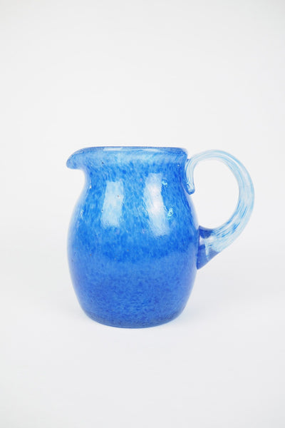 A hand blown Vintage Gass Jug with a blue speckle pattern and bubbles running through the glass. Wildmore