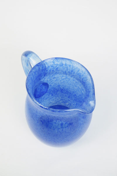A hand blown Vintage Gass Jug with a blue speckle pattern and bubbles running through the glass. Wildmore