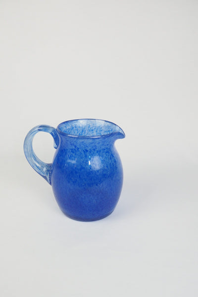 A hand blown Vintage Gass Jug with a blue speckle pattern and bubbles running through the glass. Wildmore