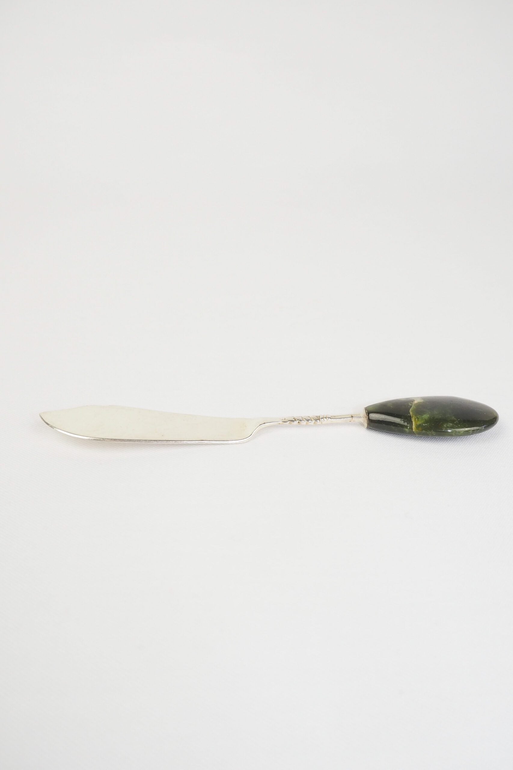 This Vintage Agate Butter Knife has a silver plated blade and a beautiful moss agate handle.