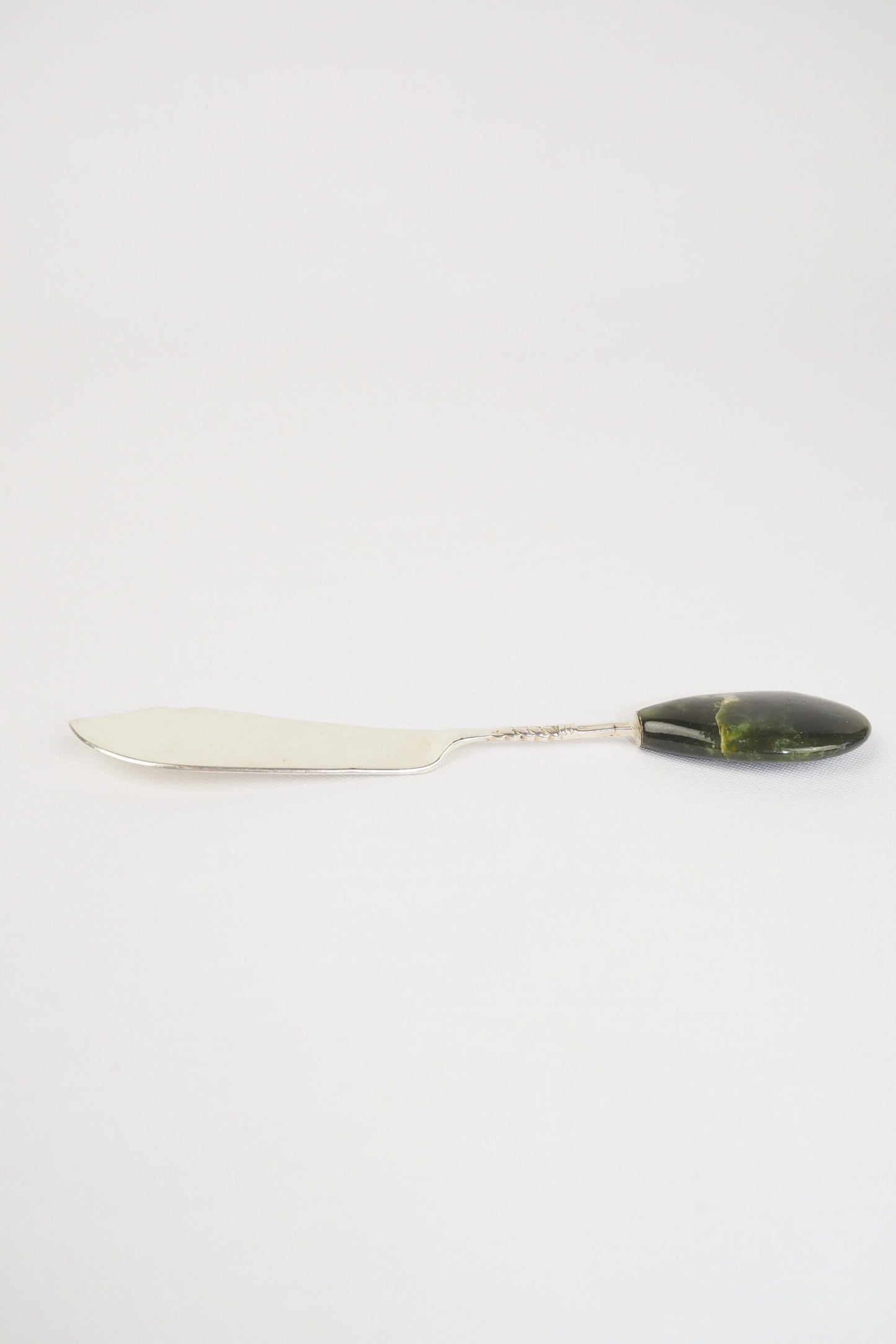 This Vintage Agate Butter Knife has a silver plated blade and a beautiful moss agate handle.