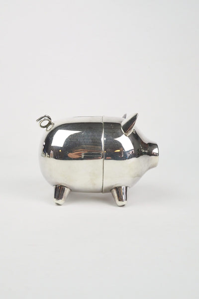 A wonderful Vintage Silver Plate Piggy Bank. This silver plated pig money box has a little curly tail and expressive ears. Wildmore