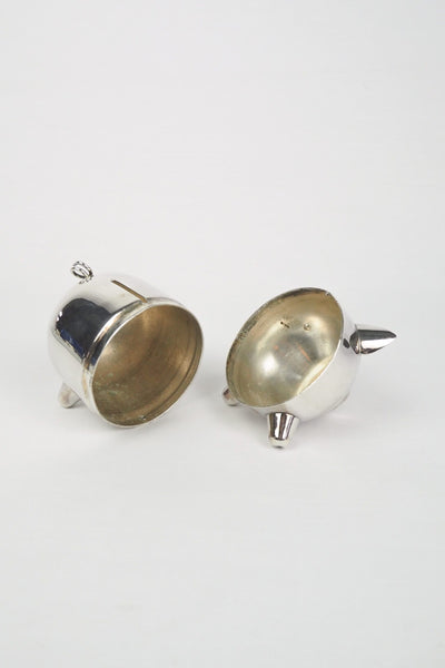 A wonderful Vintage Silver Plate Piggy Bank. This silver plated pig money box has a little curly tail and expressive ears. Wildmore