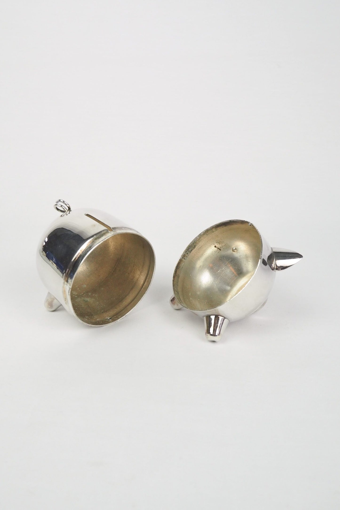 A wonderful Vintage Silver Plate Piggy Bank. This silver plated pig money box has a little curly tail and expressive ears. Wildmore