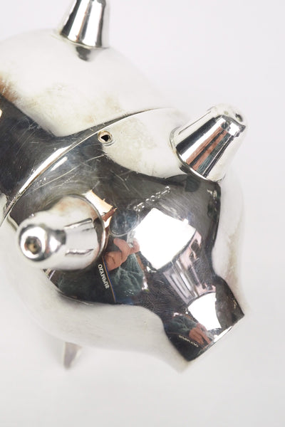 A wonderful Vintage Silver Plate Piggy Bank. This silver plated pig money box has a little curly tail and expressive ears. Wildmore