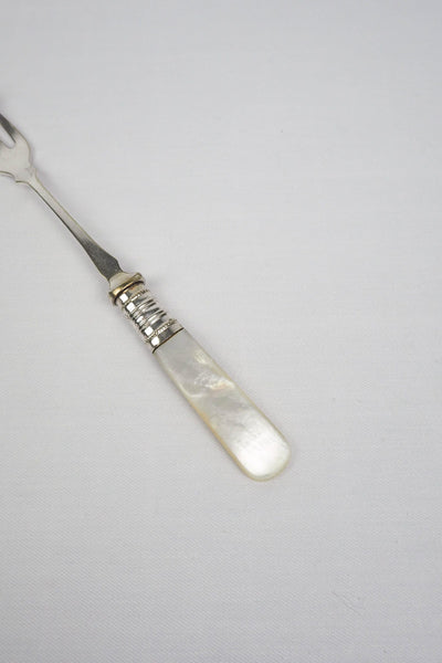 This Antique Pickle Fork has a beautiful Mother of Pearl handle, a Silver Plated neck and barbed prongs. Wildmore