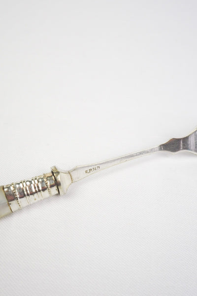 This Antique Pickle Fork has a beautiful Mother of Pearl handle, a Silver Plated neck and barbed prongs. Wildmore