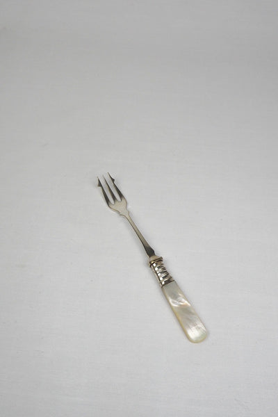 This Antique Pickle Fork has a beautiful Mother of Pearl handle, a Silver Plated neck and barbed prongs. Wildmore