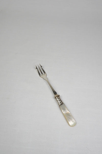 This Antique Pickle Fork has a beautiful Mother of Pearl handle, a Silver Plated neck and barbed prongs. Wildmore