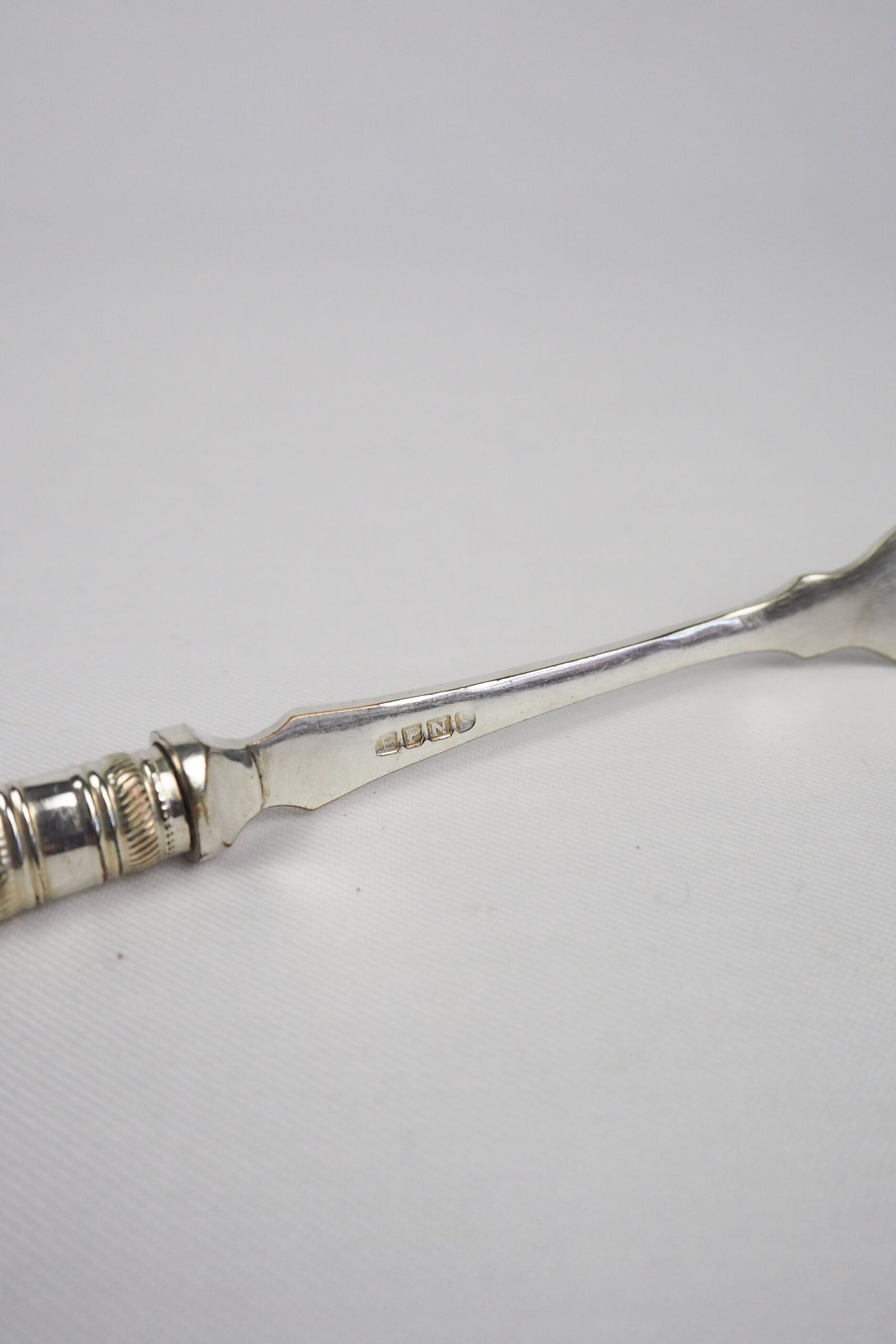 This Antique Pickle Fork has a beautiful Mother of Pearl handle, a Silver Plated neck and barbed prongs. Wildmore