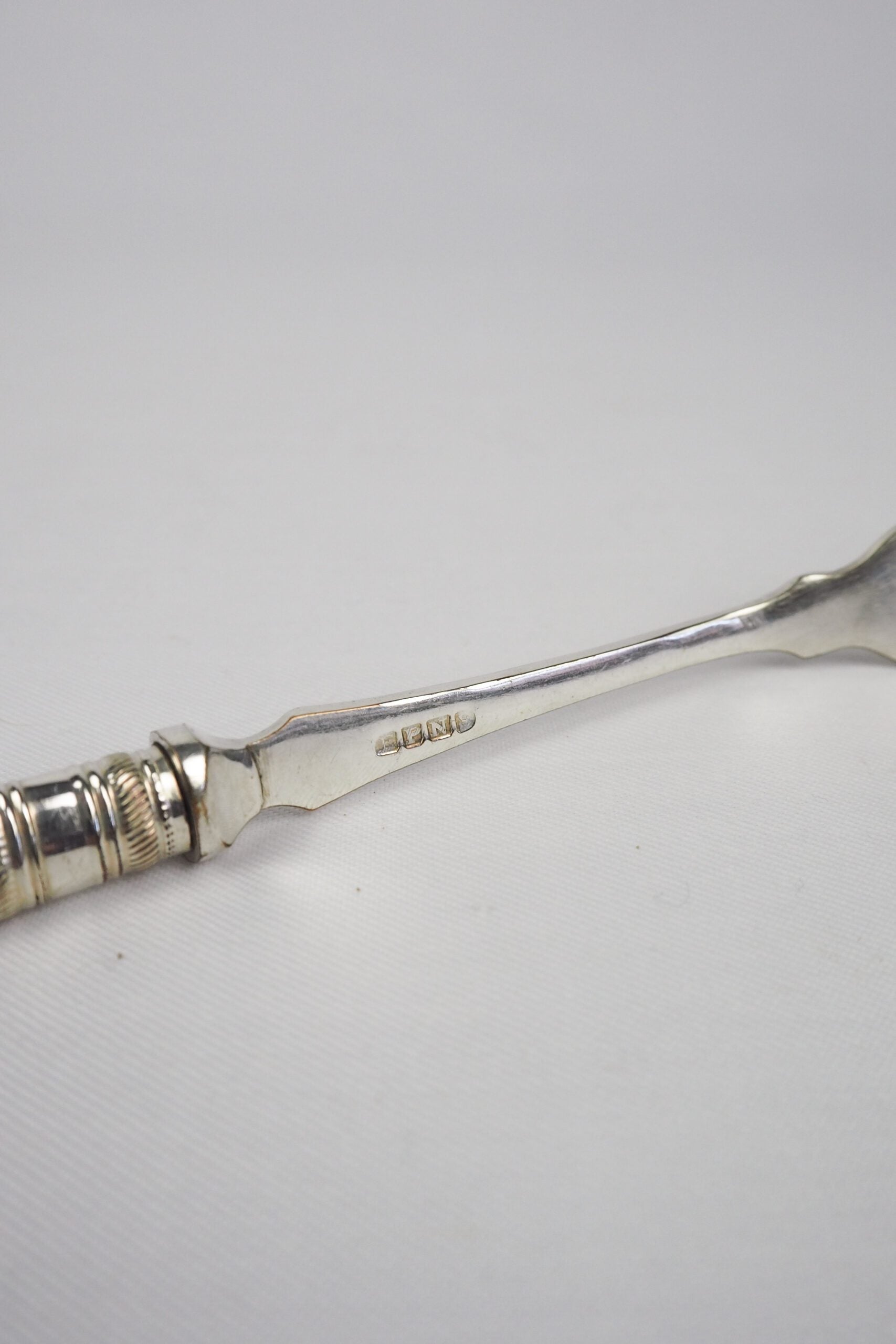 This Antique Pickle Fork has a beautiful Mother of Pearl handle, a Silver Plated neck and barbed prongs. Wildmore