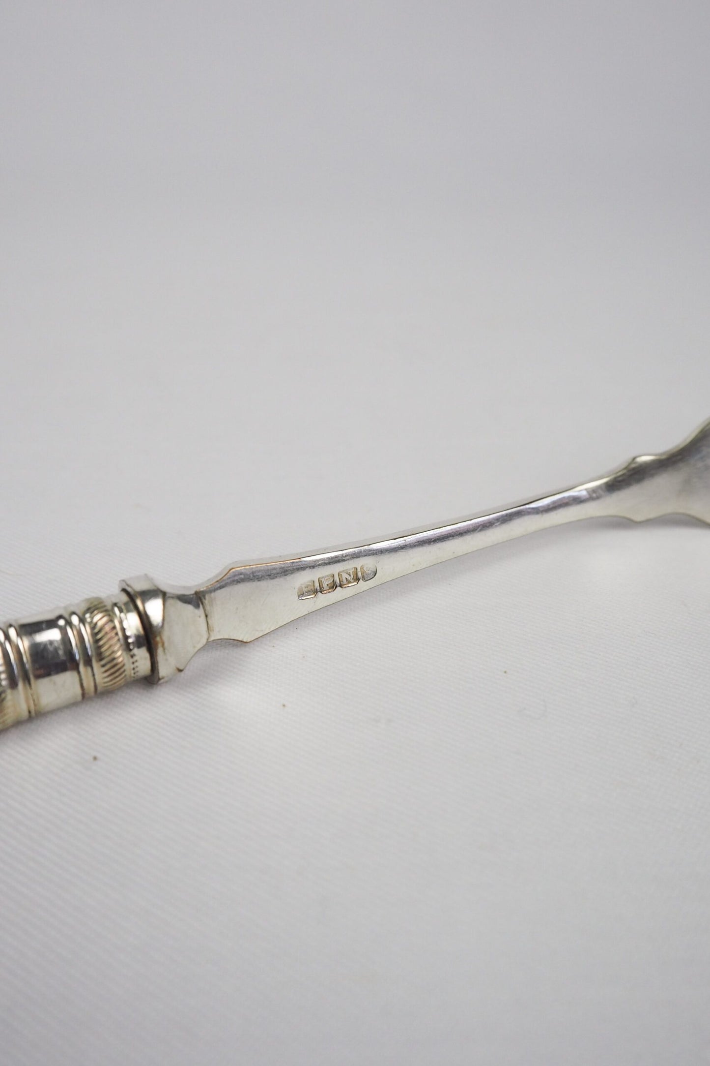 This Antique Pickle Fork has a beautiful Mother of Pearl handle, a Silver Plated neck and barbed prongs. Wildmore
