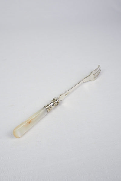 This Antique Pickle Fork has a beautiful Mother of Pearl handle, a Silver Plated neck and barbed prongs. Wildmore