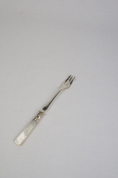 This Antique Pickle Fork has a beautiful Mother of Pearl handle, a Silver Plated neck and barbed prongs. Wildmore