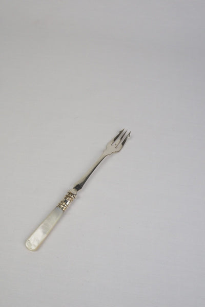 This Antique Pickle Fork has a beautiful Mother of Pearl handle, a Silver Plated neck and barbed prongs. Wildmore