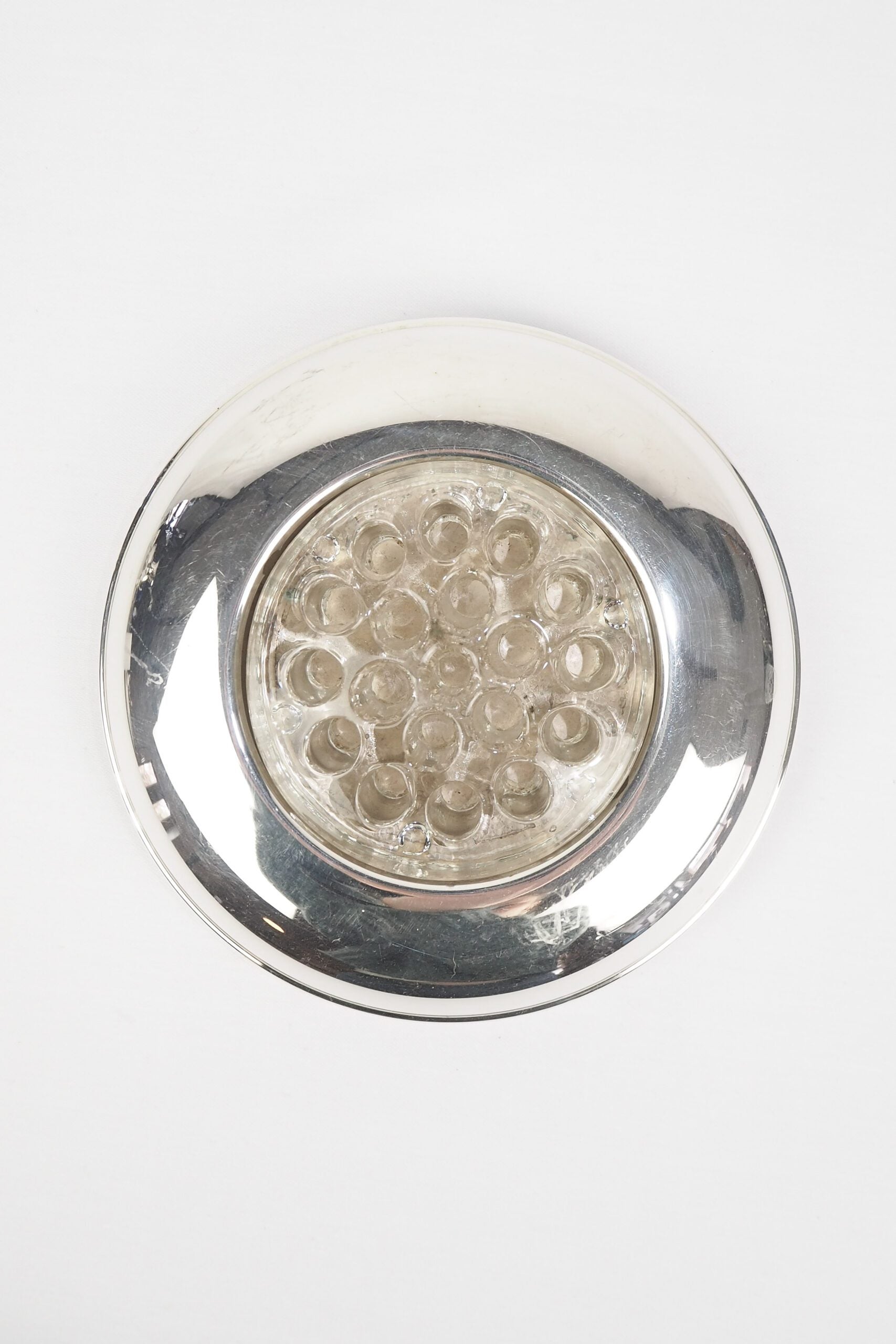 A vintage Silver Plate Flower Bowl with original glass flower frog. Filled with water, this mid century flower dish and flower frog is an elegant way to display your long stem flowers. Wildmore