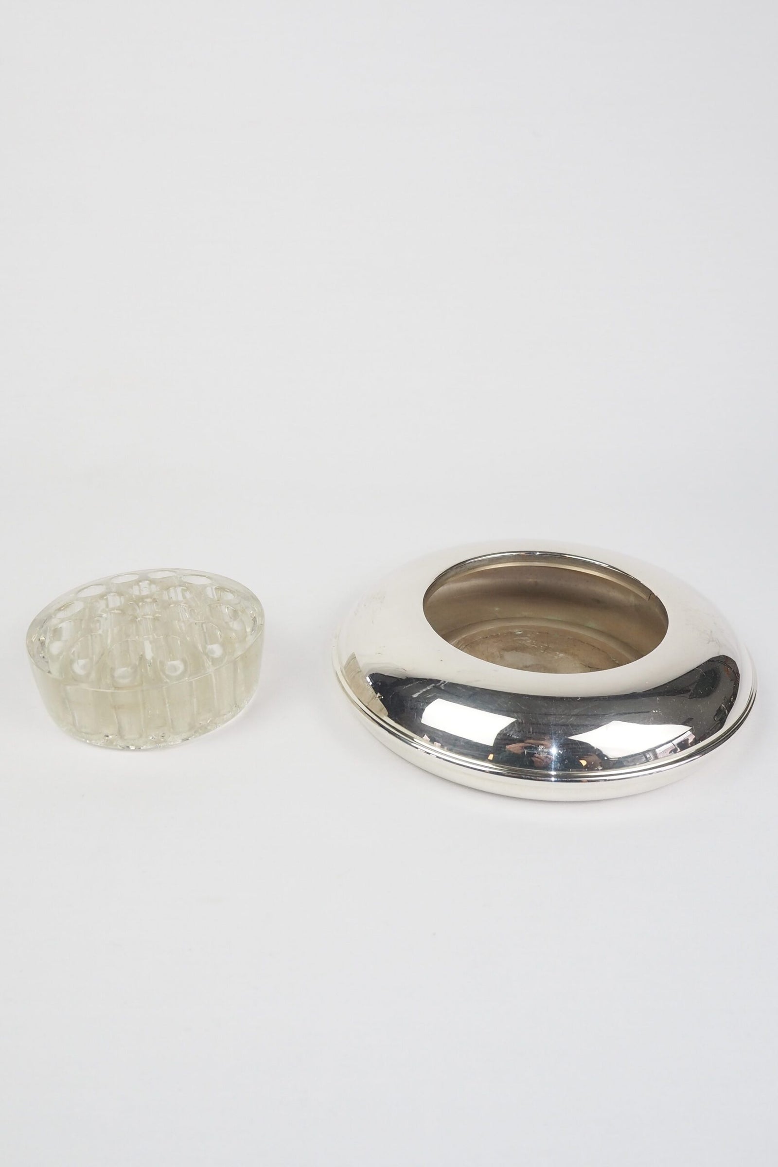 A vintage Silver Plate Flower Bowl with original glass flower frog. Filled with water, this mid century flower dish and flower frog is an elegant way to display your long stem flowers. Wildmore
