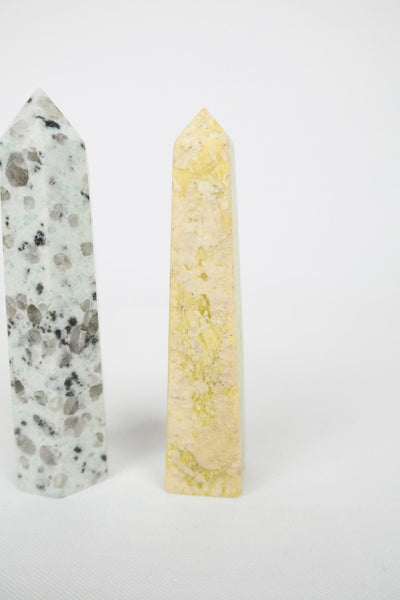 A decorative Pair of Mineral Obelisks including a Kiwi Jasper and a Serpentine Tower.