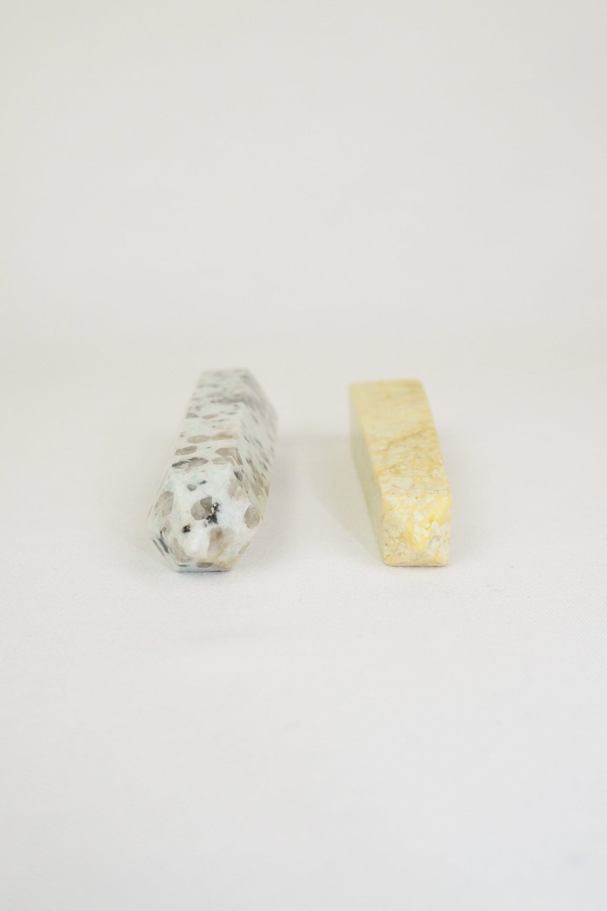 A decorative Pair of Mineral Obelisks including a Kiwi Jasper and a Serpentine Tower.