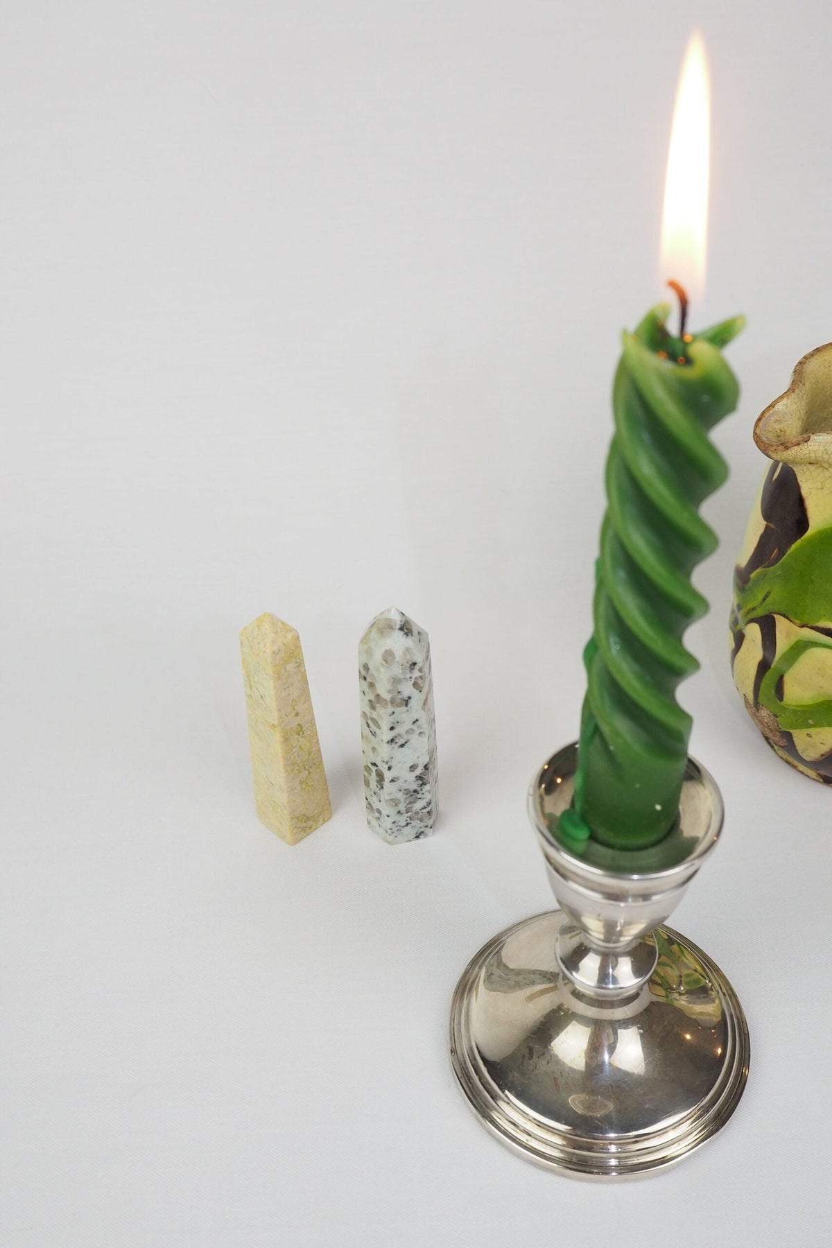A decorative Pair of Mineral Obelisks including a Kiwi Jasper and a Serpentine Tower.